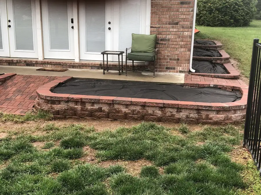 Brick planter and brick patio at a back door, Ozark, MO