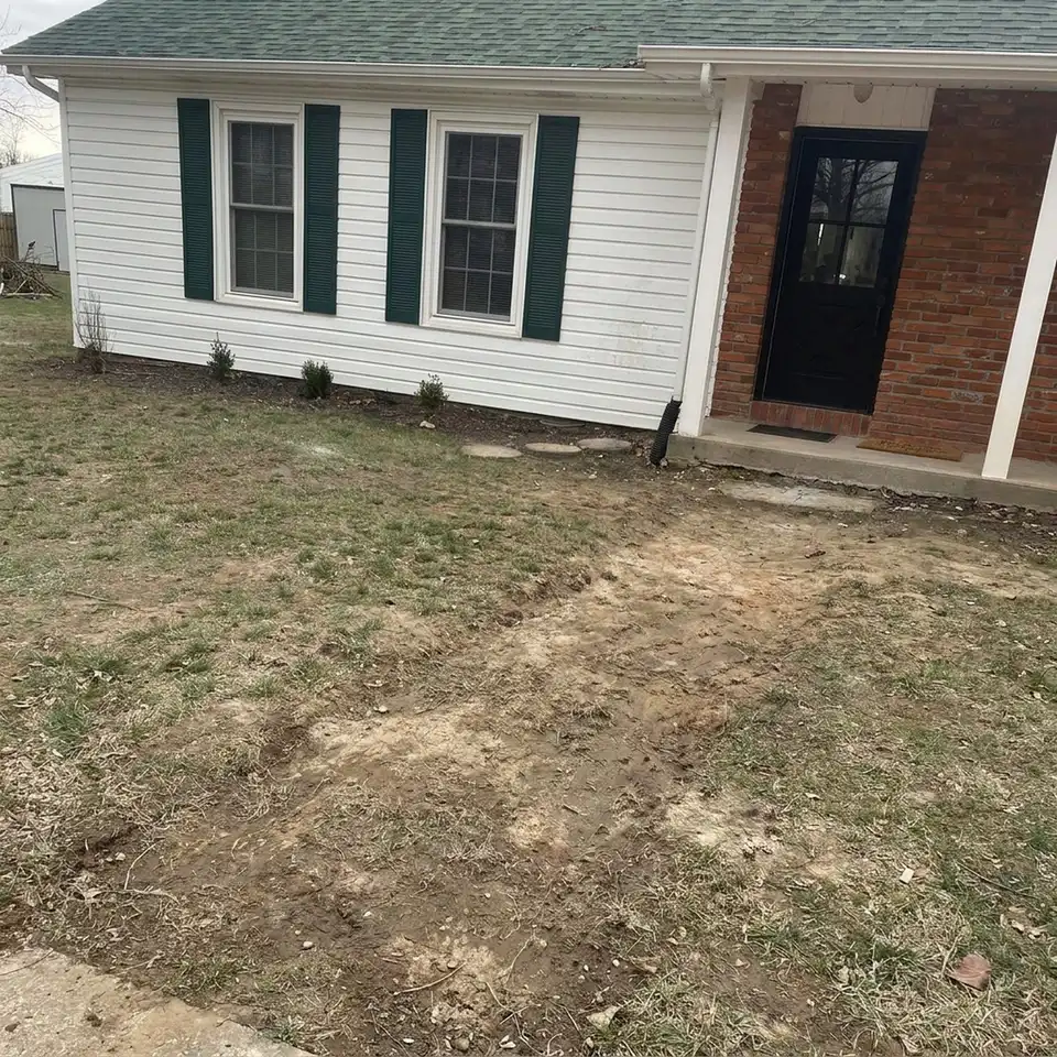 Before the work: brick paver walkway to a front door