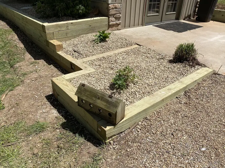 Timber-edged beds with gravel and plantings, Nixa, MO