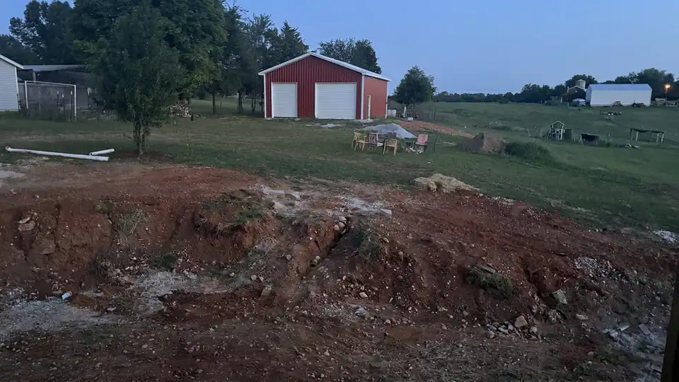 Before the work: block retaining wall with built-in steps and lighting